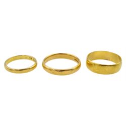 Three 22ct gold wedding bands, all hallmarked