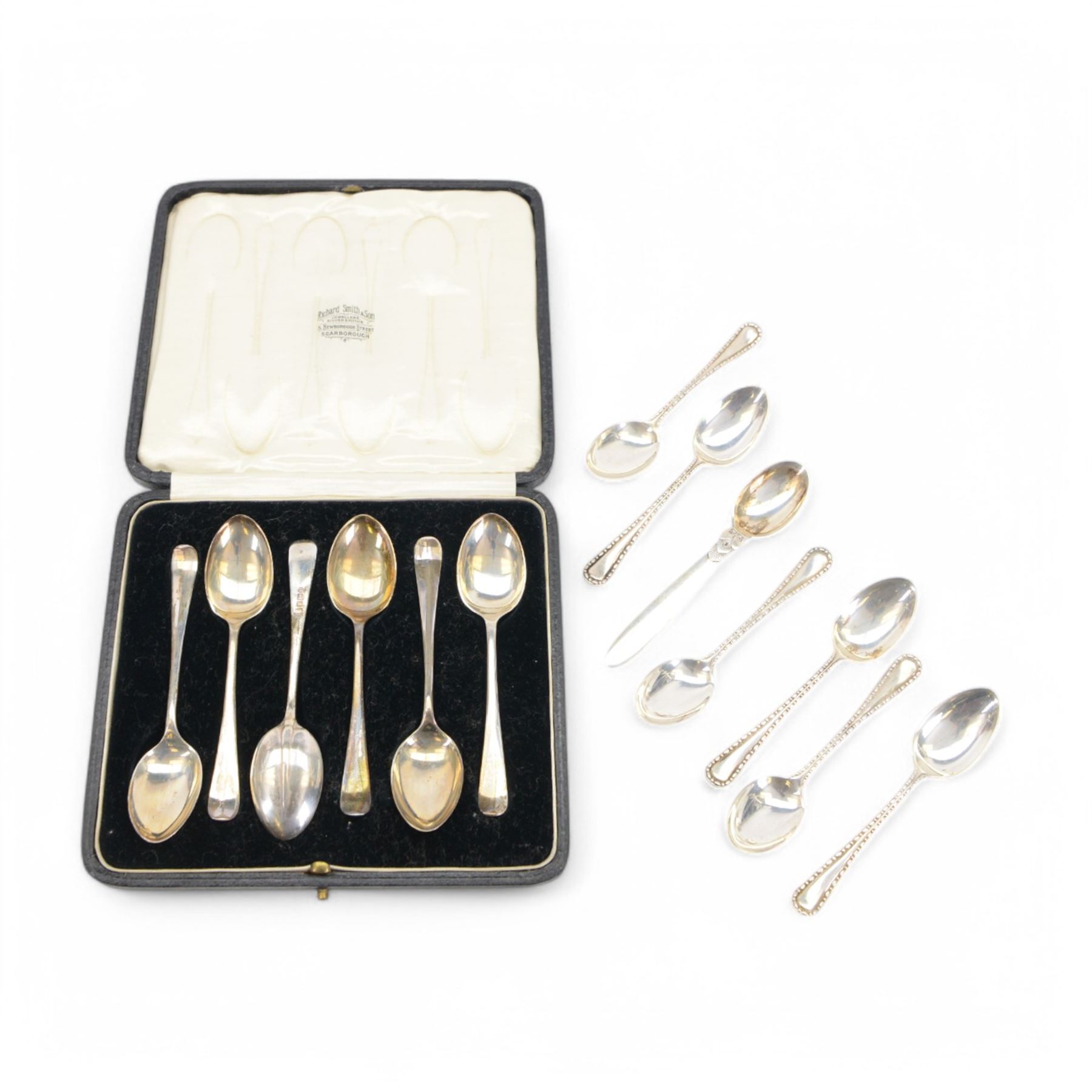 Danish silver demitasse spoon, stamped Georg Jensen, Sterling, Denmark, together with two sets of early 20th century silver coffee spoons, all hallmarked