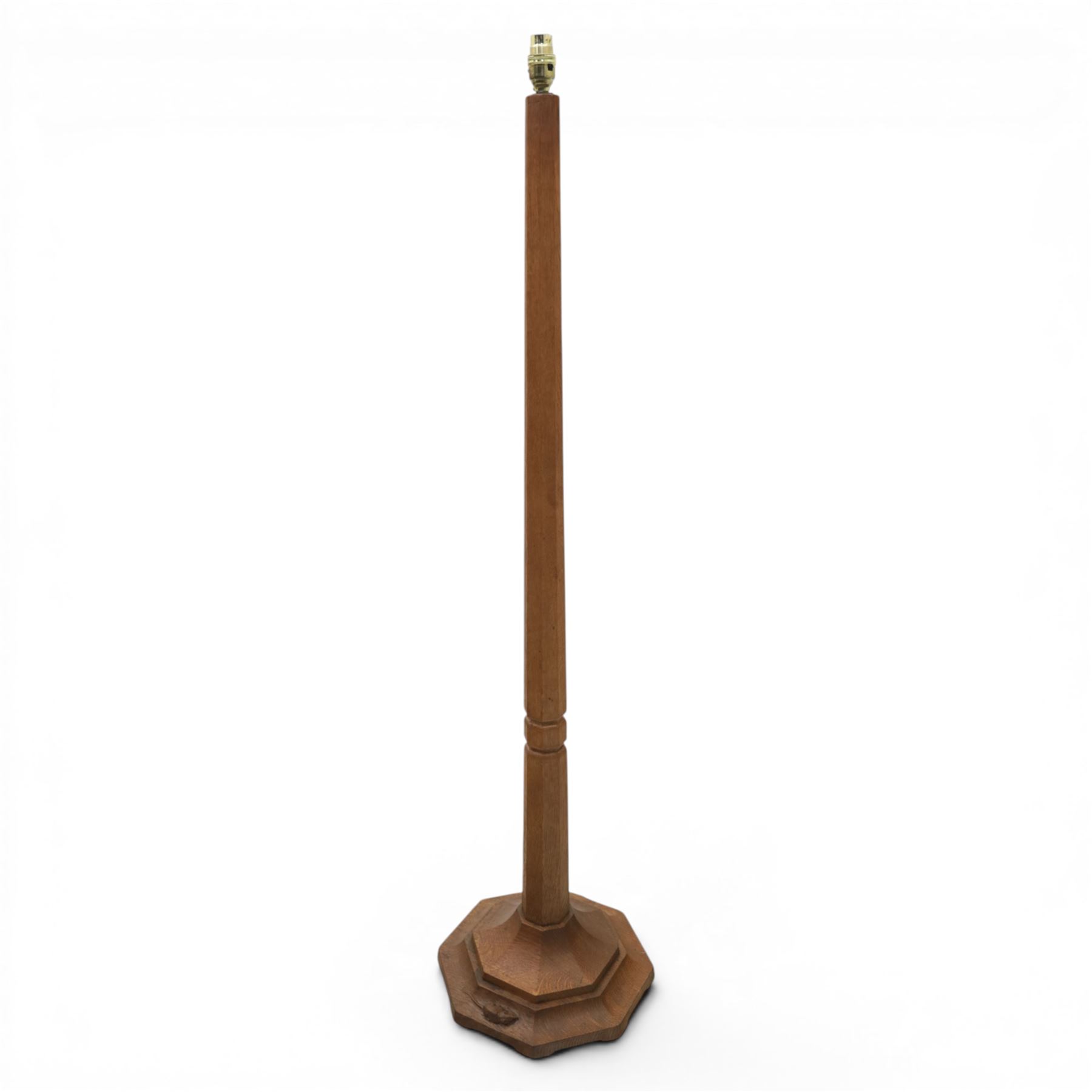 Mouseman - oak standard lamp, with octagonal base and column, with carved mouse by the workshop of Robert Thompson of Kilburn