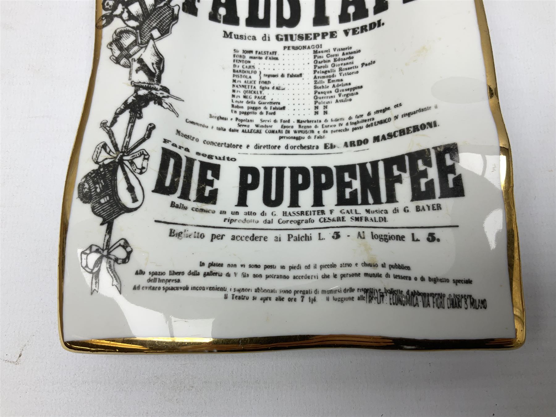 Fornasetti rectangular 'Falstaff' operatic billboard ashtray decorated with black and white text with a gilt border edge,  with printed mark beneath, H22cm 