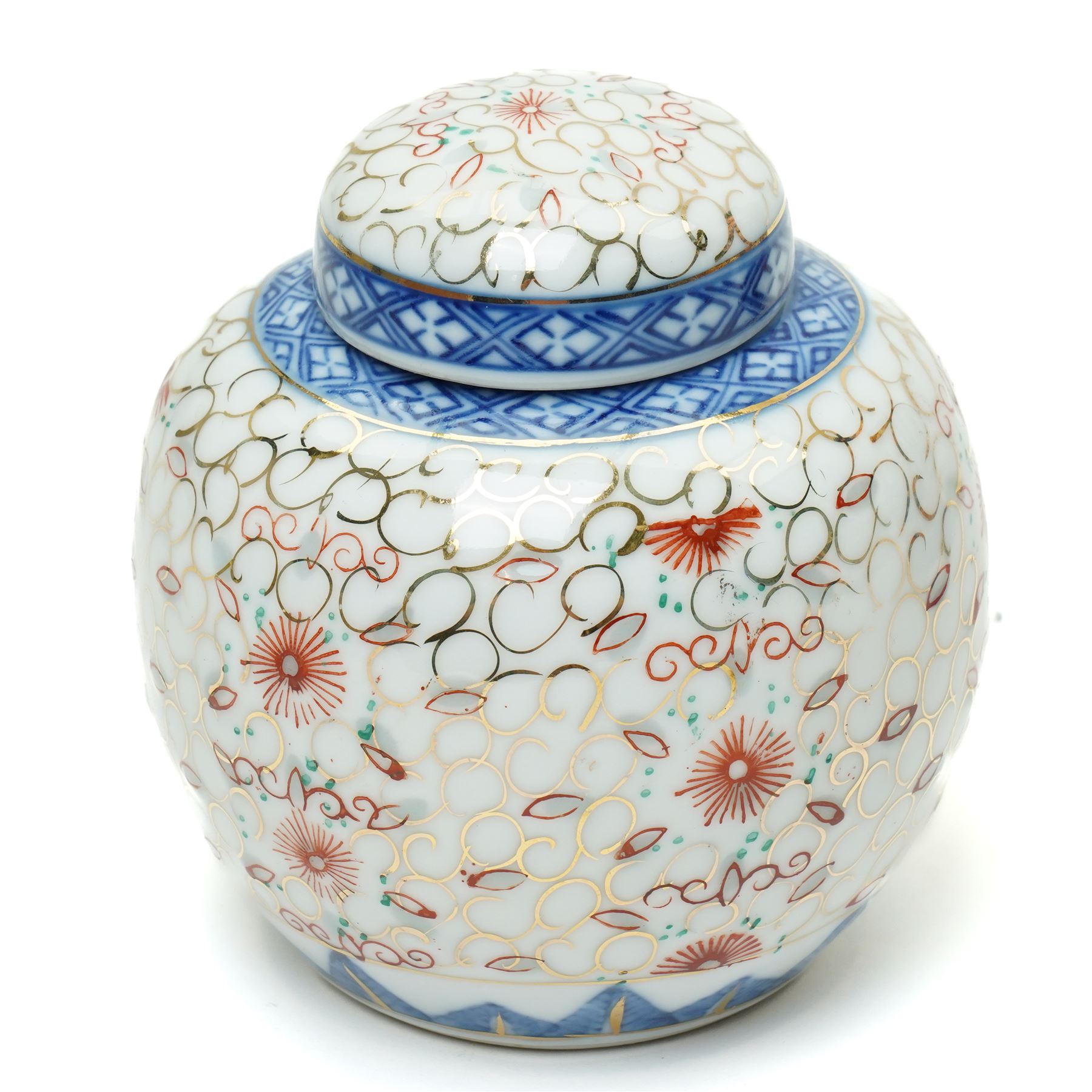 Late 19th/Early 20th century Japanese Imari bowl decorated with panels of flowers in blue, orange and green etc D27cm, Imari vase H24cm and a small ginger jar (3)