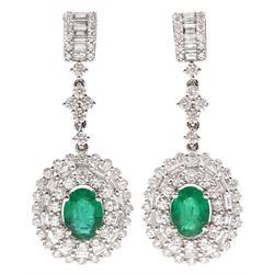 Pair of 18ct white gold oval cut emerald, baguette and round brilliant cut diamond cluster pendant stud earrings, stamped 750, total emerald weight approx 2.15 carat, total diamond weight approx 2.45 carat