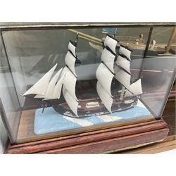 Boat model in box and another smaller in glazed diorama