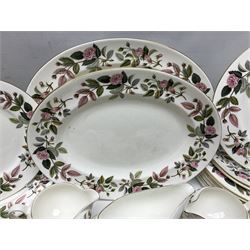 Wedgwood Hathaway Rose pattern tea and dinner wares, comprising twelve saucers, sixteen teacups, twenty tea plates, jug, sucrier, thirteen shallow bowls, sauce boat and saucer, two lidded tureens, larger jug, ten dinner plates, nine smaller plates and two large oval serving dishes