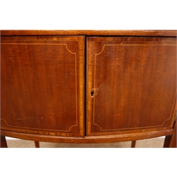  Edwardian inlaid and satinwood crossbanded bow front sewing cabinet, twin lifting top with fitted interior, faux frieze drawer above two doors on slender tapering supports, W55cm, H78cm, D34cm  