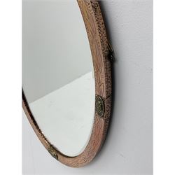 Hammered brass and copper framed, bevel edged oval mirror