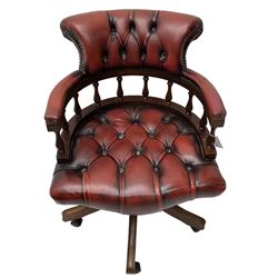 Swivel Captain's desk chair, upholstered in red studded leather