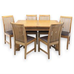 Contemporary oak extending dining table, moulded rectangular top with visible grain and in...