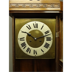  Early 20th century stained beech wall clock, twin train movement, striking the hours and half on coil, H78cm  