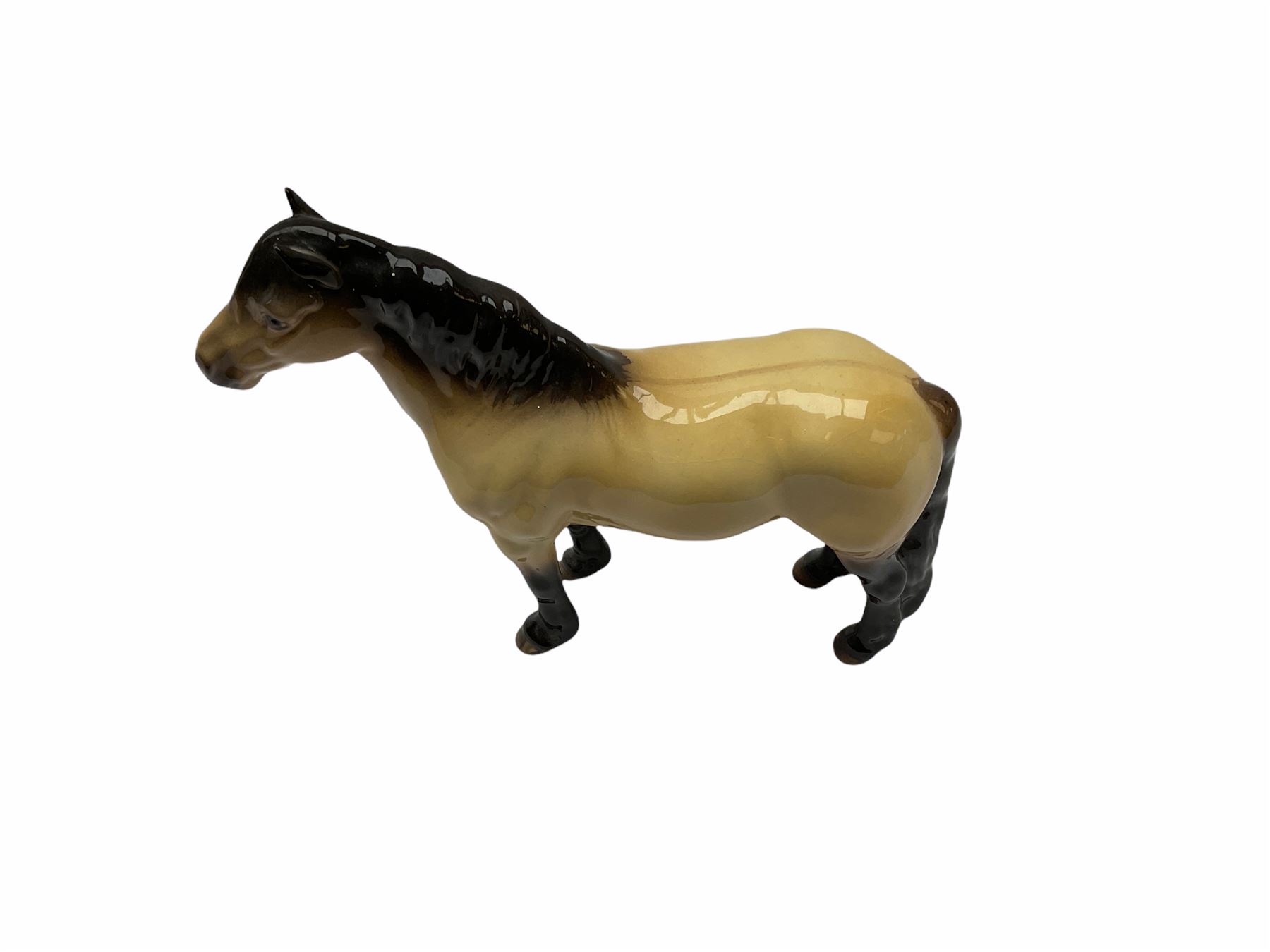 Beswick horse figures, comprising Highland Pony 1644, and another, probably Aran Bahram in grey, each with printed mark beneath.
