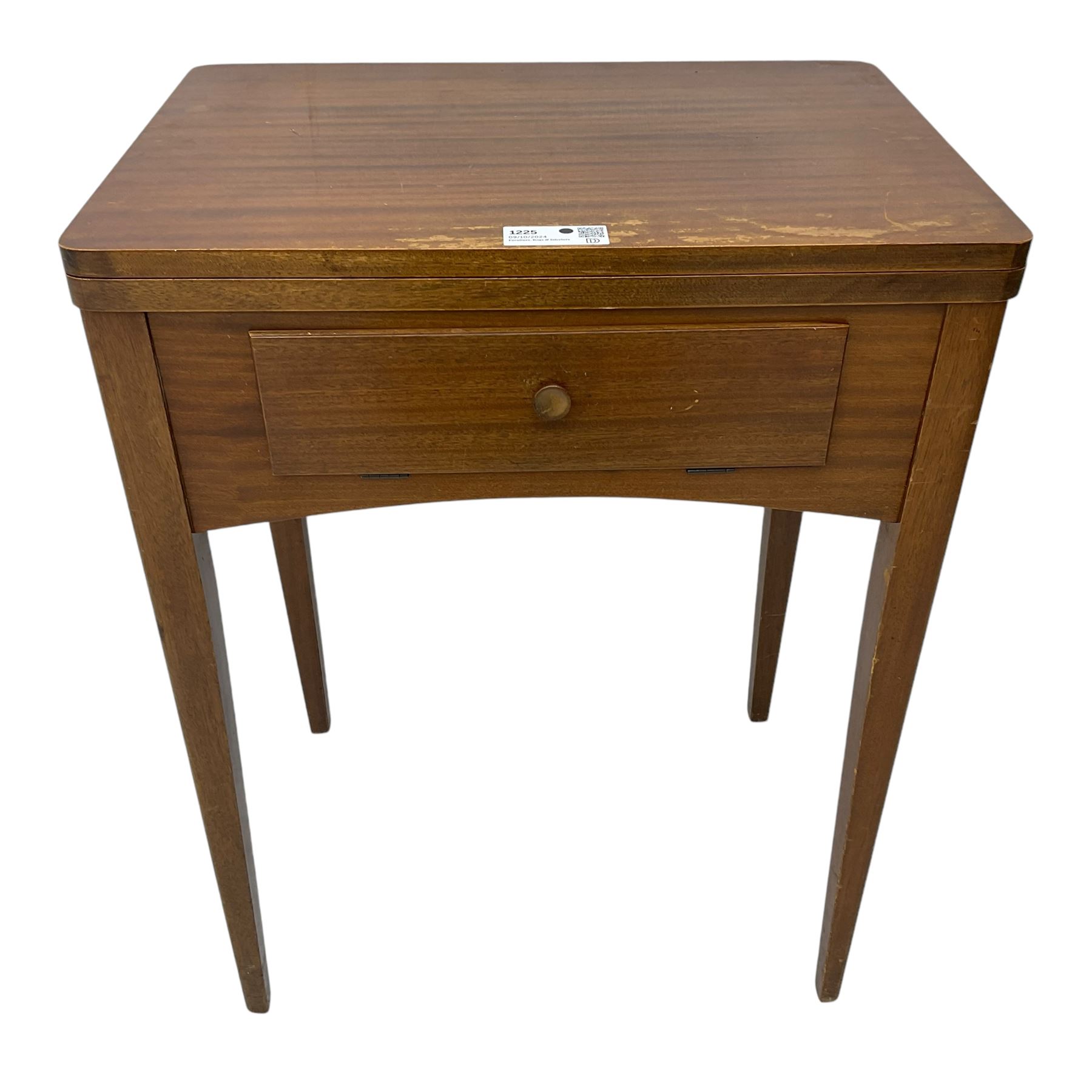 Mid-20th century teak sewing table, rectangular top with hinged fold-out extension revealing built-in Singer sewing machine, fitted with single hinged drawer, on square tapered supports; various Singer accessories to include Fashion Discs and Motor Controller