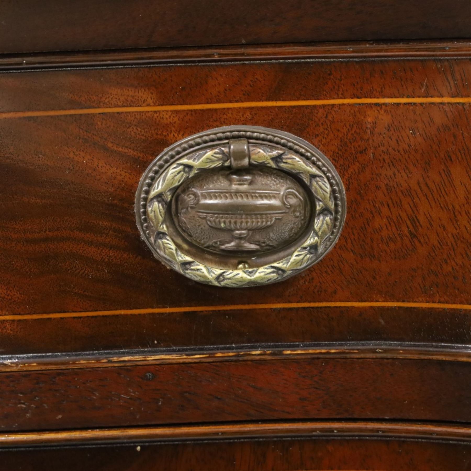 Georgian design mahogany serpentine sideboard, shaped top over two central drawers flanked by cupboard doors, flame mahogany veneered fronts with satinwood stringing, oval brass handles, shaped apron, on square tapering supports with spade feet