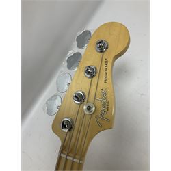 Fender Precision Bass guitar, in Olympic White finish with tortoiseshell effect scratchboard, serial no US15103092, in black Fender hard case with Fender strap and warranty card, guitar L116cm