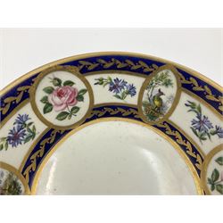 19th Sèvres style porcelain cup and saucer, the cup painted with a figural scene, against a scalloped border of scrolling floral swags on a blue ground, together with a Sèvres soft paste porcelain coffee can and saucer, painted with panels of exotic birds, roses and a border of cornflowers, LL monogram enclosing date letters H above painters mark, coffee can H6.5cm, saucer D13.5cm (2)