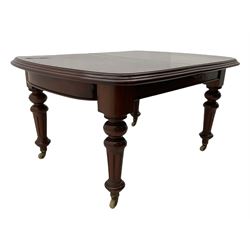 Victorian mahogany extending dining table, pull out action, with two leaves, turned legs on ceramic castors