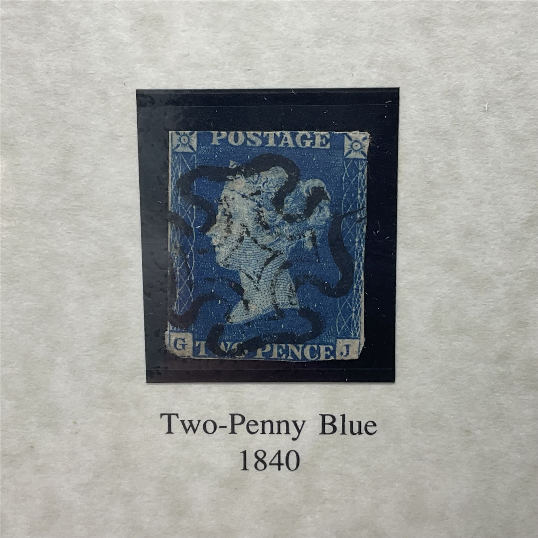 Great Britain Queen Victoria penny black stamp with black MX cancel and 1840 two pence blue stamp with black MX cancel, both housed in folders