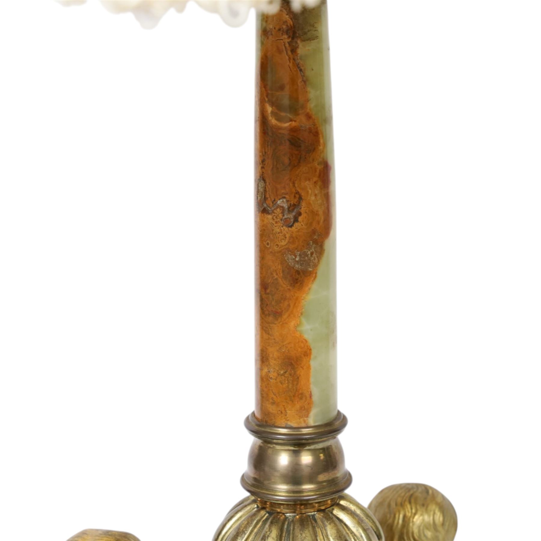 Second Empire style gilt metal table lamp, the hexagonal plinth base with applied foliate decoration, upon six turned feet, supporting three seated allegorical putti, the first modelled with a tablet and stylus representing literature, the second with hammer representing sculpture, and the third with Corinthian column capital representing Architecture, each intersected by a stylised scroll with central flower head panel, mounted upon an onyx and gilt metal Corinthian column with wrythen flower moulded and part fluted base, supporting a cream octagonal shade, overall H86cm