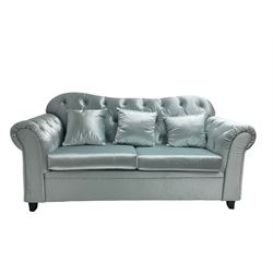 Chesterfield shaped two seat sofa, upholstered in buttoned light blue fabric, with scatter cushions