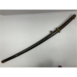 WW2 Japanese Army officer's shin gunto/katana sword with 68.5cm steel single edged blade, foliate cast brass tsuba, bound fish-skin grip with brass mounts, inscribed marks to both sides of tang; in lacquered wooden scabbard with brass mounts and locking button L97cm overall