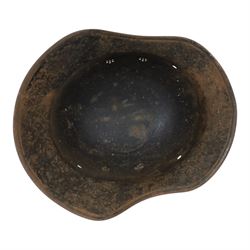 WWII German Third Reich M1940 helmet, with desert camouflage, the left inner brim stamped SE64, the back inner brim stamped 506, with leather eight tongue liner, together with German M34 helmet