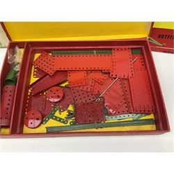 Meccano - Outfits 4, 6 & 7 with red and green parts; Outfits 4 & 6 virtually fully stocked and Outfit 7 containing large quantity of loose parts; Outfits 4 & 7 with instruction manuals; all boxed (3)