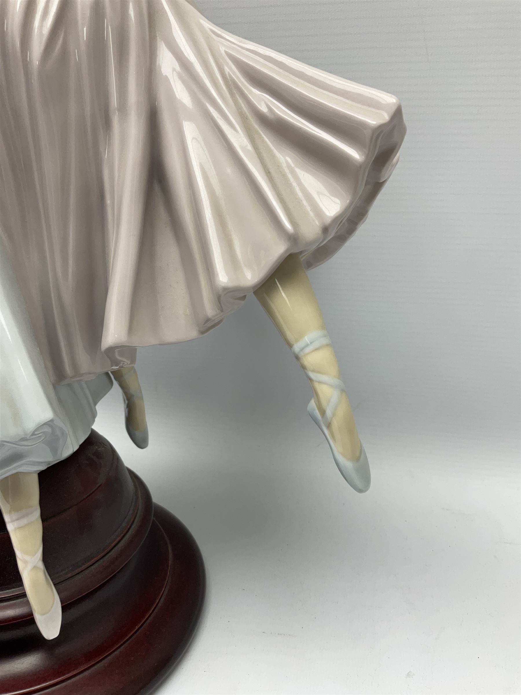 Lladro figure group, 'Merry Ballet', modelled as two ballerinas in dancing pose, raised on a turned socle base, no. 5035, printed marks beneath, H49cm