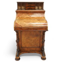 Victorian figured walnut piano top Davenport desk, hidden compartment lifting to reveal small drawers and pigeonholes, the piano lid enclosing drawers and sliding top with hinged leather writing surface, the right-hand side fitted with four drawers, on compressed bun feet 