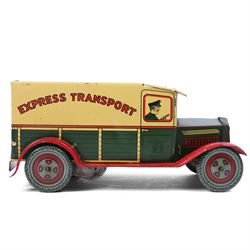 Wells Brimtoy tinplate clockwork 'Express Transport' delivery van, green body with cream roof and red highlights, with lithographed details, fixed key, H7.5cm, L17cm