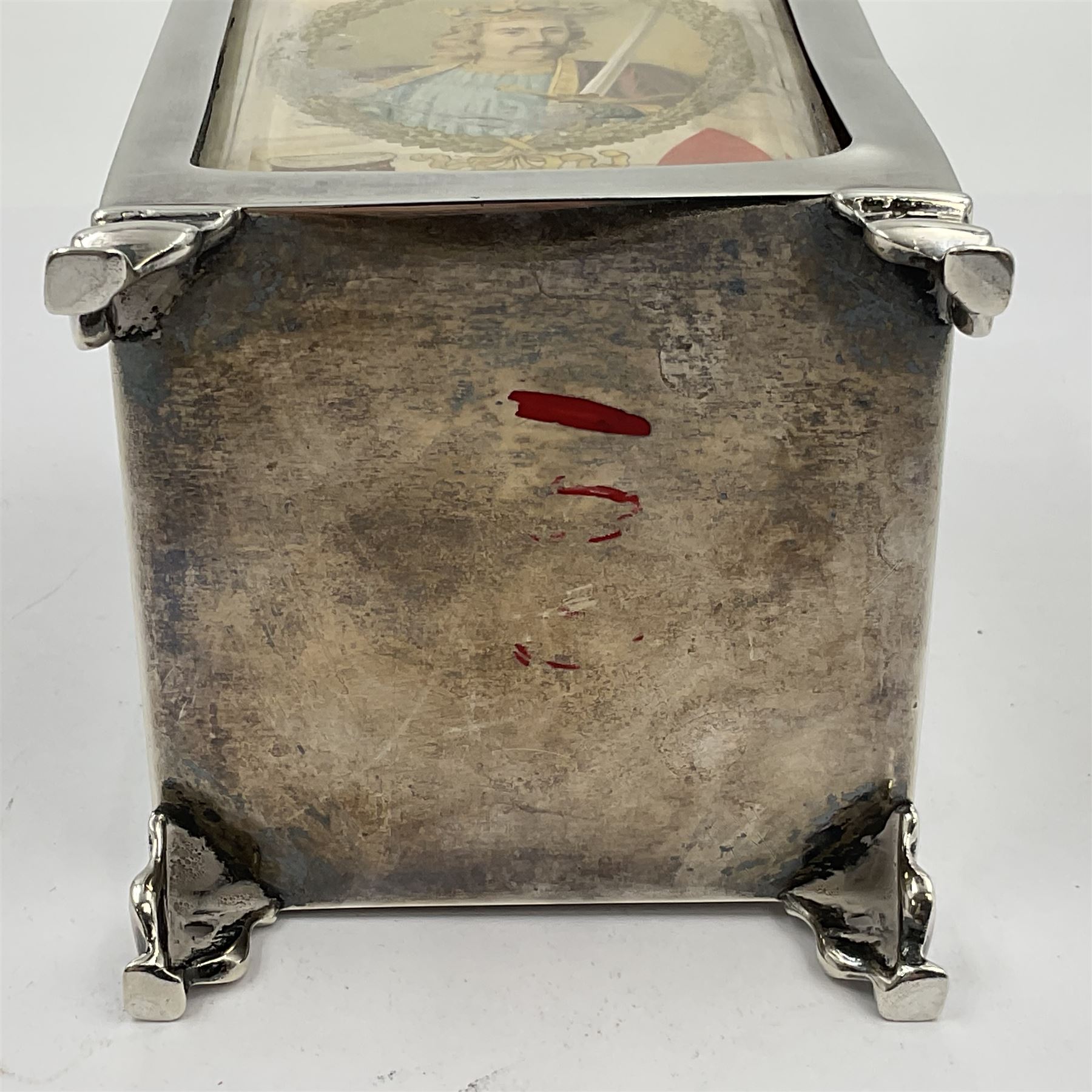 Edwardian silver mounted playing card case, hallmarked William Harrison Walter, Birmingham 1903, the sides each with a period playing card set behind a bevelled glass panel, the hinged cover with later engraving 'Presented to Norman T Crombie Esq by the officers & men of the 31st WR Detachment for services rendered 1917-1918', with red leather lined interior, the three compartments upon a sprung base and containing two later wooden Whist markers, case H12.5cm