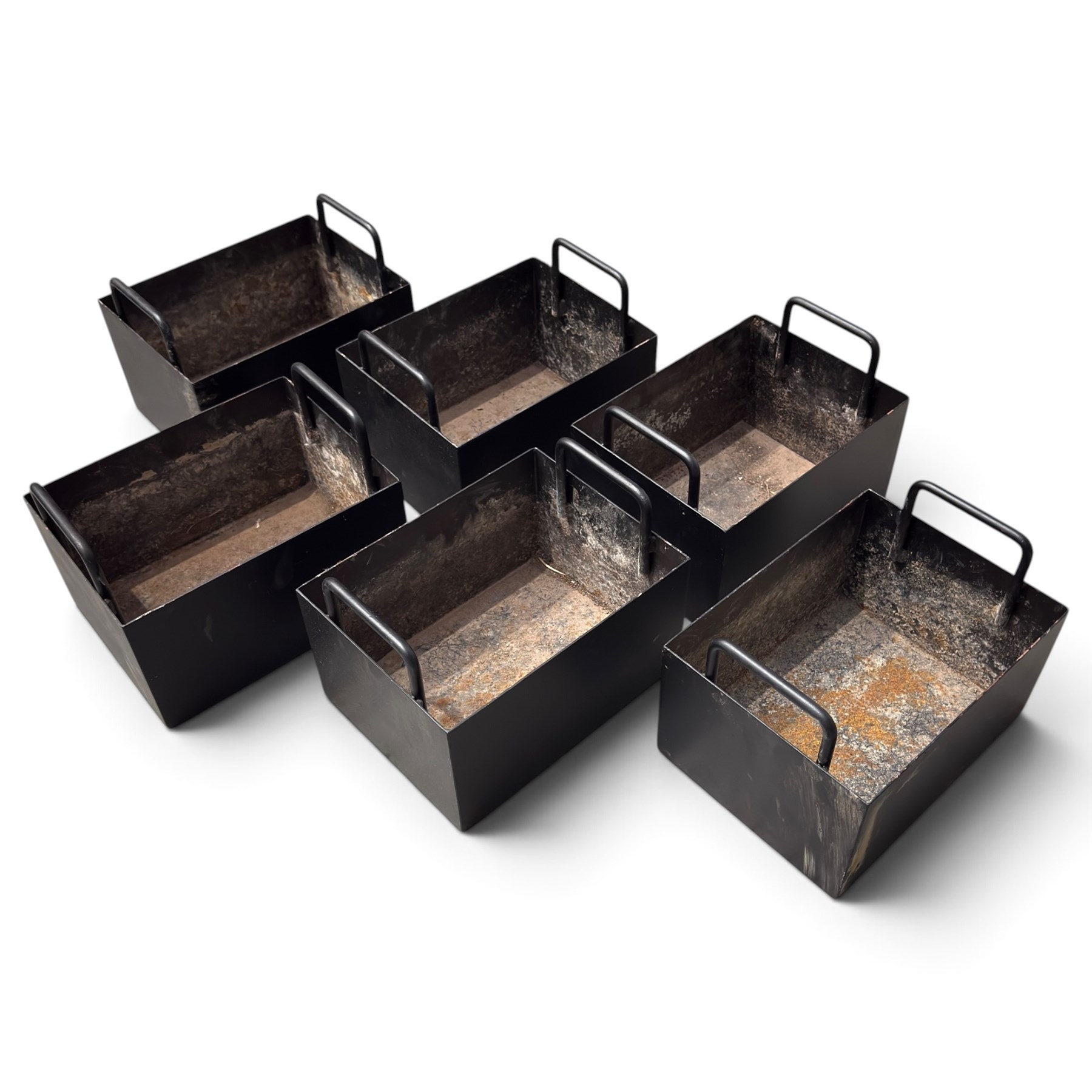 Black-painted iron herb planter, the long rectangular body embossed ‘Thyme, Basil, Oregano, Parsley, Mint’ with applied foliate decoration, containing five removable handled liners