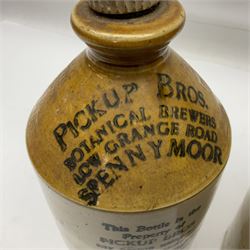 Early 20th century stoneware advertising flagon, marked to front 'Pickup Bros Botanical Brewers', together with a larger stoneware flagon