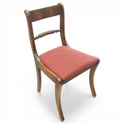 Late 20th century Regency style mahogany dining chairs, set of six comprising four single chairs and two open armchairs, bar backs with figured veneered top rails and turned spindle stretchers, overstuffed seats, on sabre supports