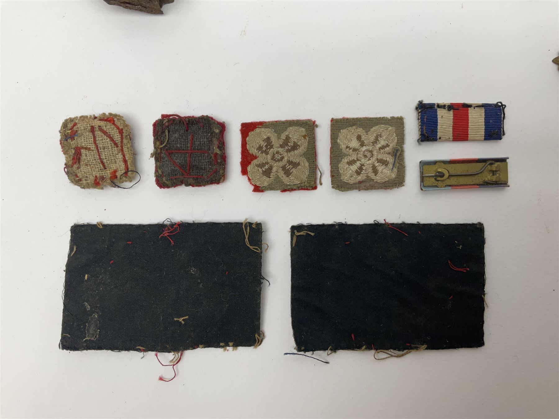 WW2 German Luftwaffe Mess cutlery comprising table spoon and fork, each with H.M.Z.38 mark; WW1 British War Medal awarded to L-13858 Gnr. J. McCabe R.A.; and small quantity of military badges, rank pips etc