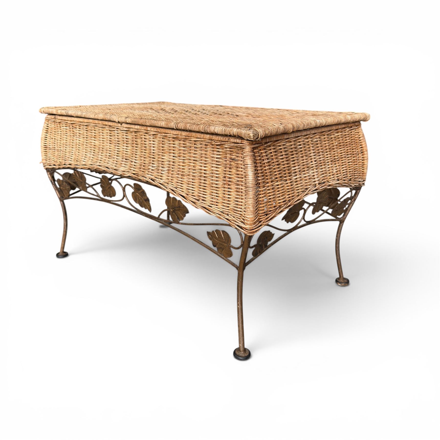 Basket work coffee table featuring scrolling leaf edging on tapered lags