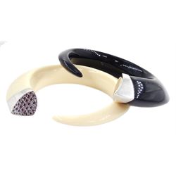 Shaun Leane silver and red topaz ivory resin Tusk bangle, one other black Tusk bangle by the same hand, both hallmarked and an gilt and ivorine bead necklace