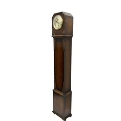 1950’s - 8-day oak cased grandmother clock, flat top with chamfered corners, long trunk with applied beadwork decoration, rectangular plinth raised on bracket feet, circular silvered dial with Arabic numerals and spade hands, three train Westminster chiming movement chiming the quarters and hours on 8 gong rods. With pendulum.  