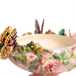 Delphin Messier (1836-1907), glazed earthenware cache-pot, decorated with three butterflies surrounded by floral and foliate motifs. upon a pink circular foot, signed beneath, H24cm