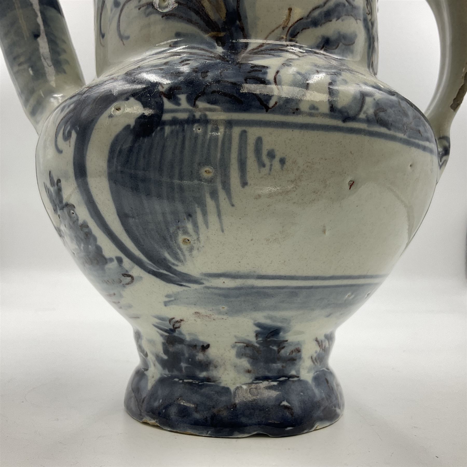 Tin glazed earthenware wet drug jug, decorated with cherubs in a landscape, H90cm 