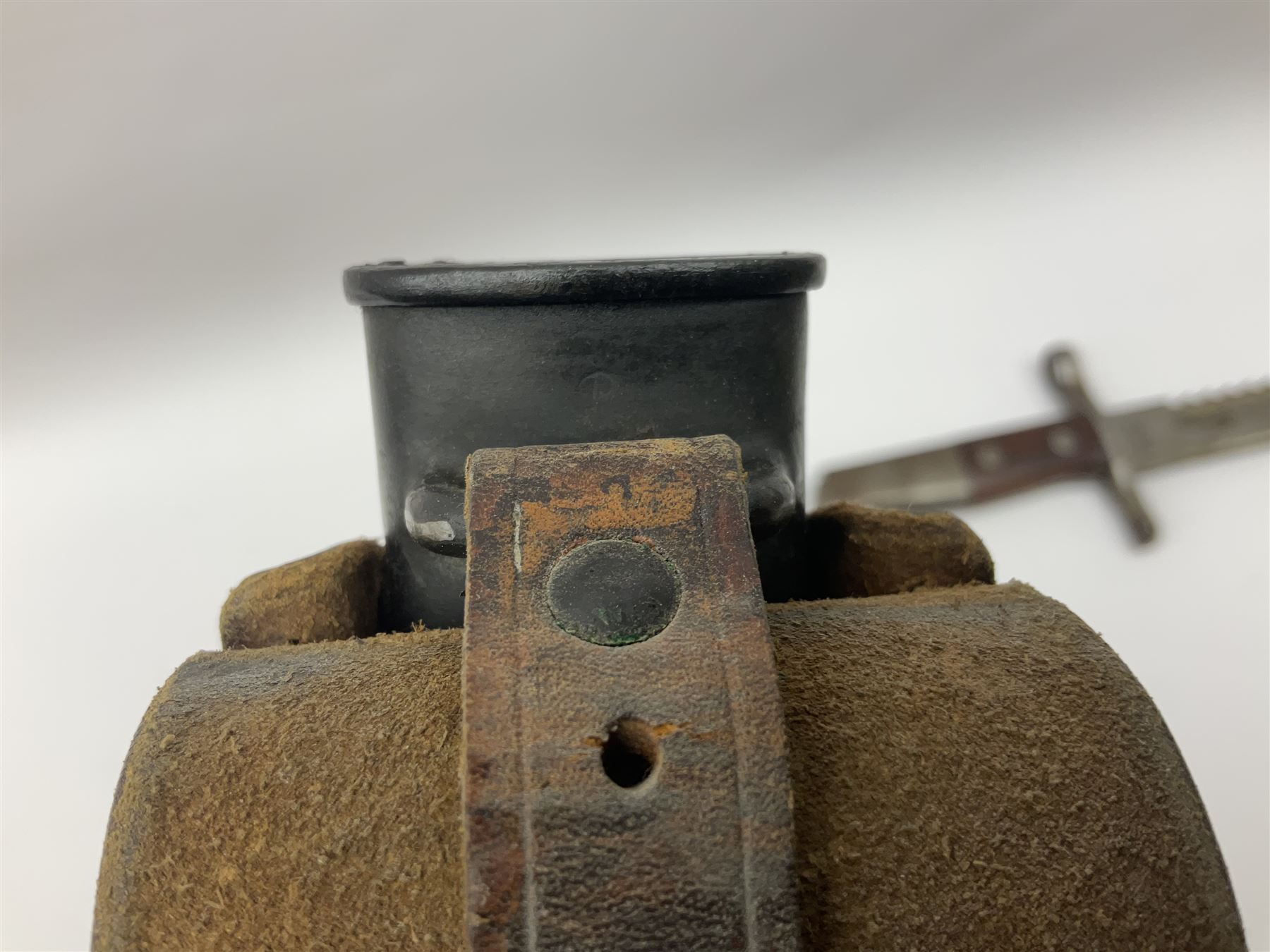 Swiss Schmidt-Rubin M1914 pioneer bayonet, with 48cm steel saw-back blade, the ricasso stamped, ''Waffenfabrik, Neuhausen'', the crosspiece stamped Swiss cross, steel scabbard, leather frog L64cm overall