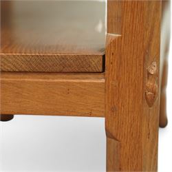 Mouseman - oak side table or buffet, raised back over rectangular canted adzed top, fitted with two drawers, raised on four octagonal turned supports united by undertier, carved with mouse signature, by the workshop of Robert Thompson, Kilburn 