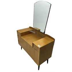  Mid-20th century light oak dressing table, raised shaped mirror back over two short and two long drawers, on splayed and tapering black finish supports 