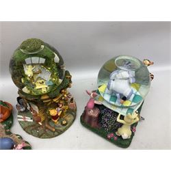 Five Disney Winnie The Pooh snow globes to include The Rain Rain Rain Came Down Down Down, Eeyore Pulling Cart, Owl's House, Rumbly in My Tumbly and Stuck In Rabbit's House, together with figure group with dome, five with boxes (6)
