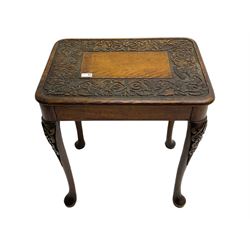 Late 19th century oak table, rectangular top with band carved scrolls and dragon masks, on cabriole supports 