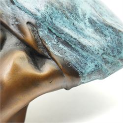 Bronze figure, modelled as a nude woman removing her shirt, signed Milo, H17cm