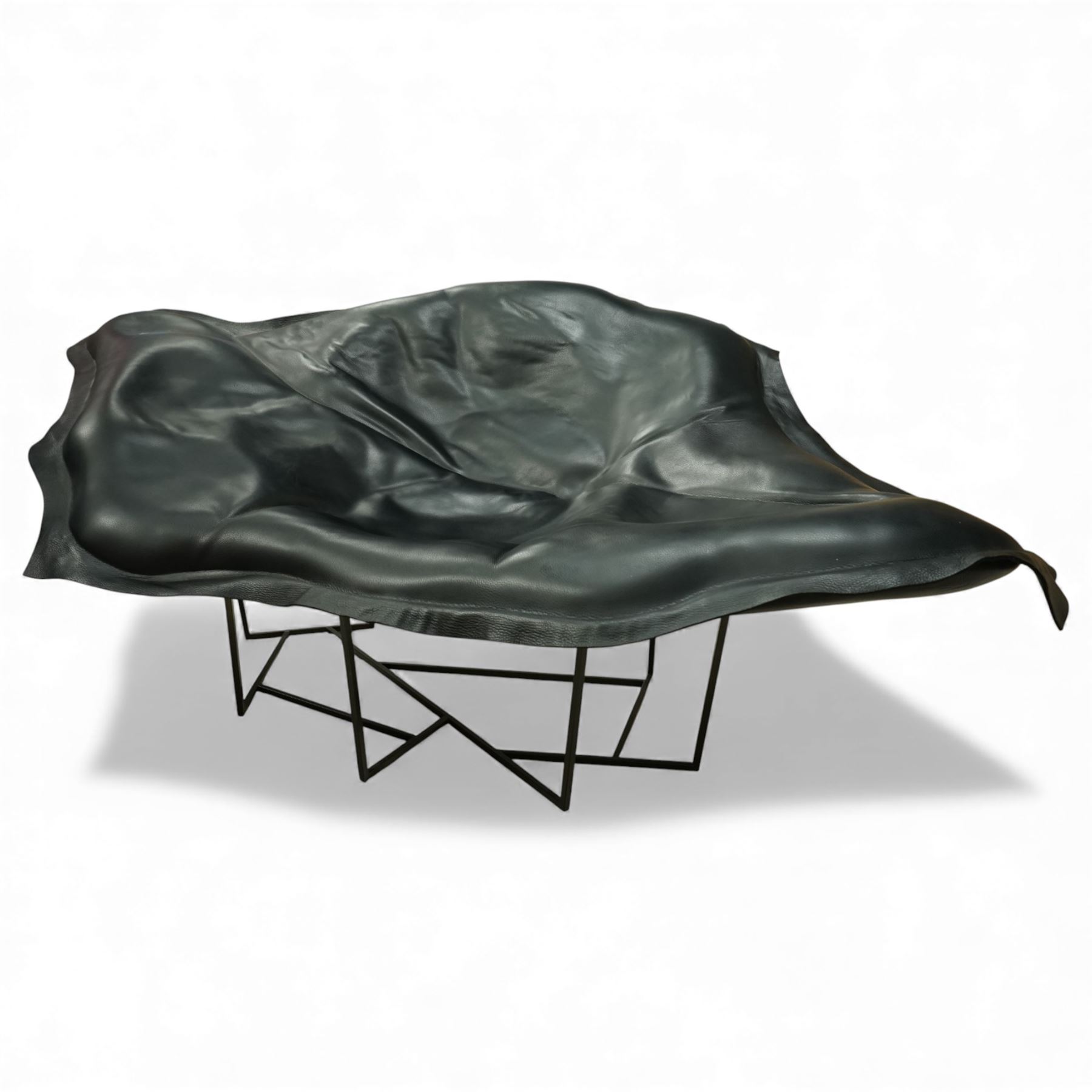 Poliform - ‘Wallace’ armchair, sculptural leaf-form silhouette upholstered in black leather, raised on triangular metal supports