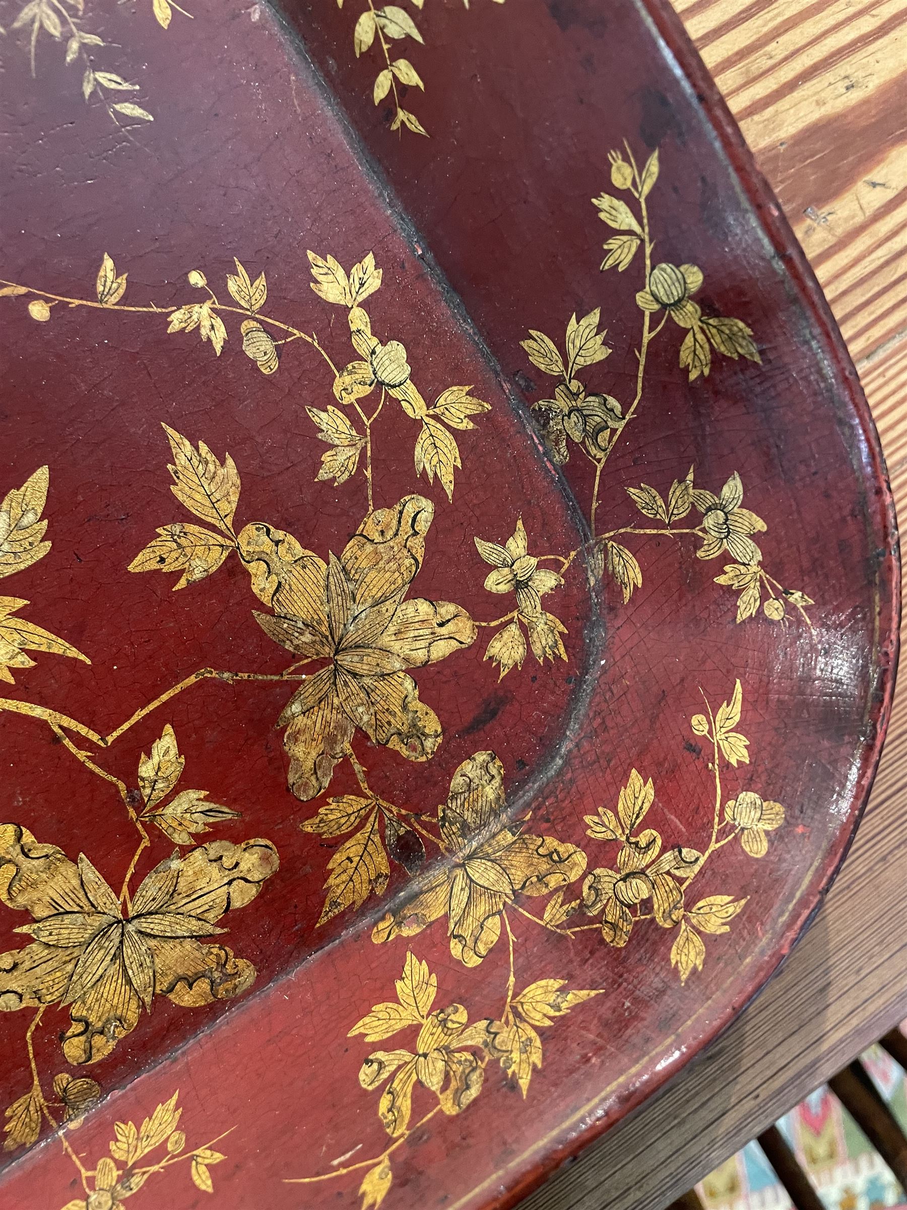 Early 19th century red lacquered papier-mâché tray by Clay of King Street Covent Garden, of rounded rectangular form, painted in gilt with large foliate sprays and butterflies, impressed verso CLAY KING ST COVENT GARDEN, W66.5cm D48.5cm