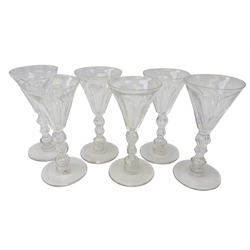  Set of six 19th century wine glasses, the faceted trumpet bowls on triple knop stems, H14cm (6)  
