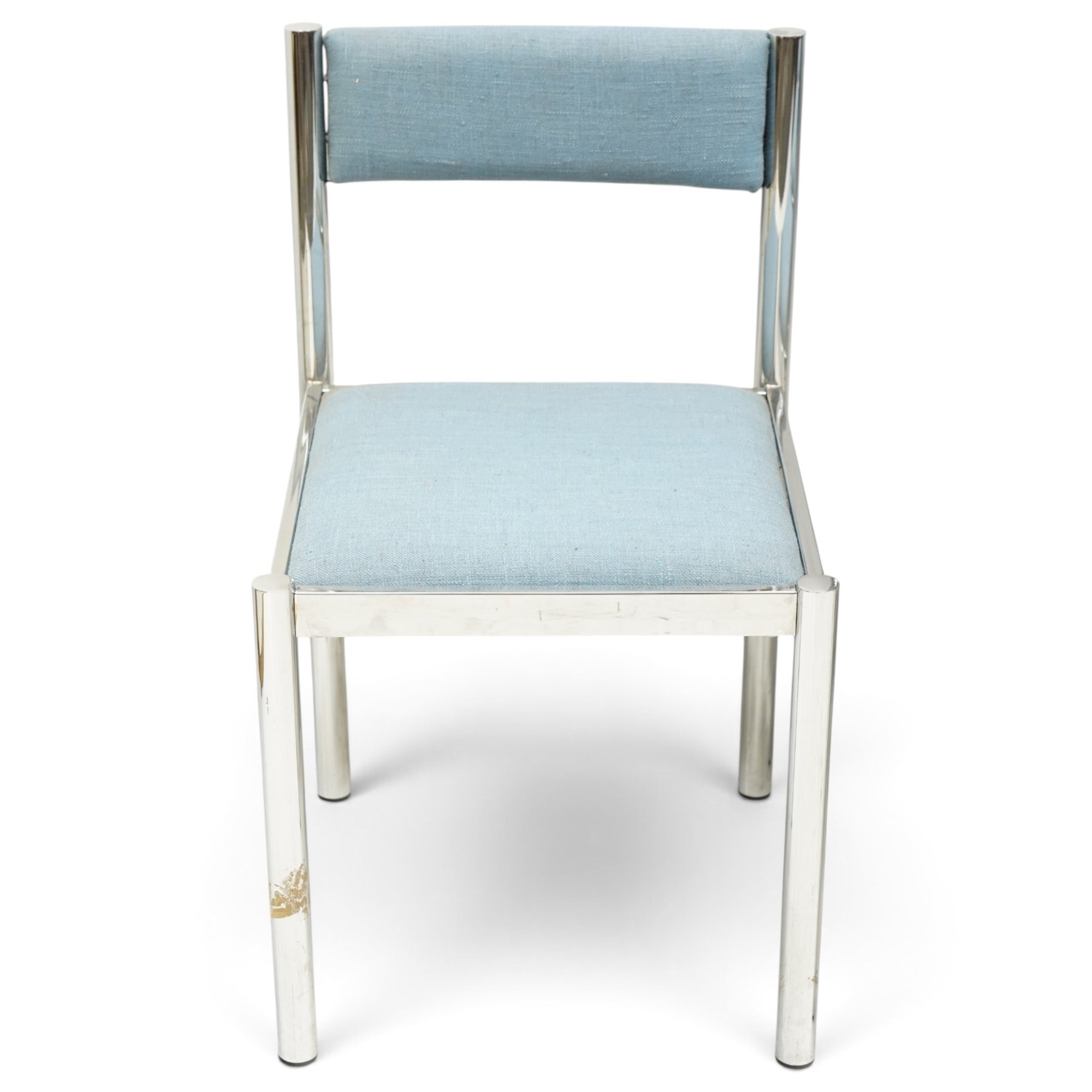 Set of eight 1980s chrome and upholstered dining chairs, curved back bar over padded seats upholstered in blue fabric, on tubular chrome frames