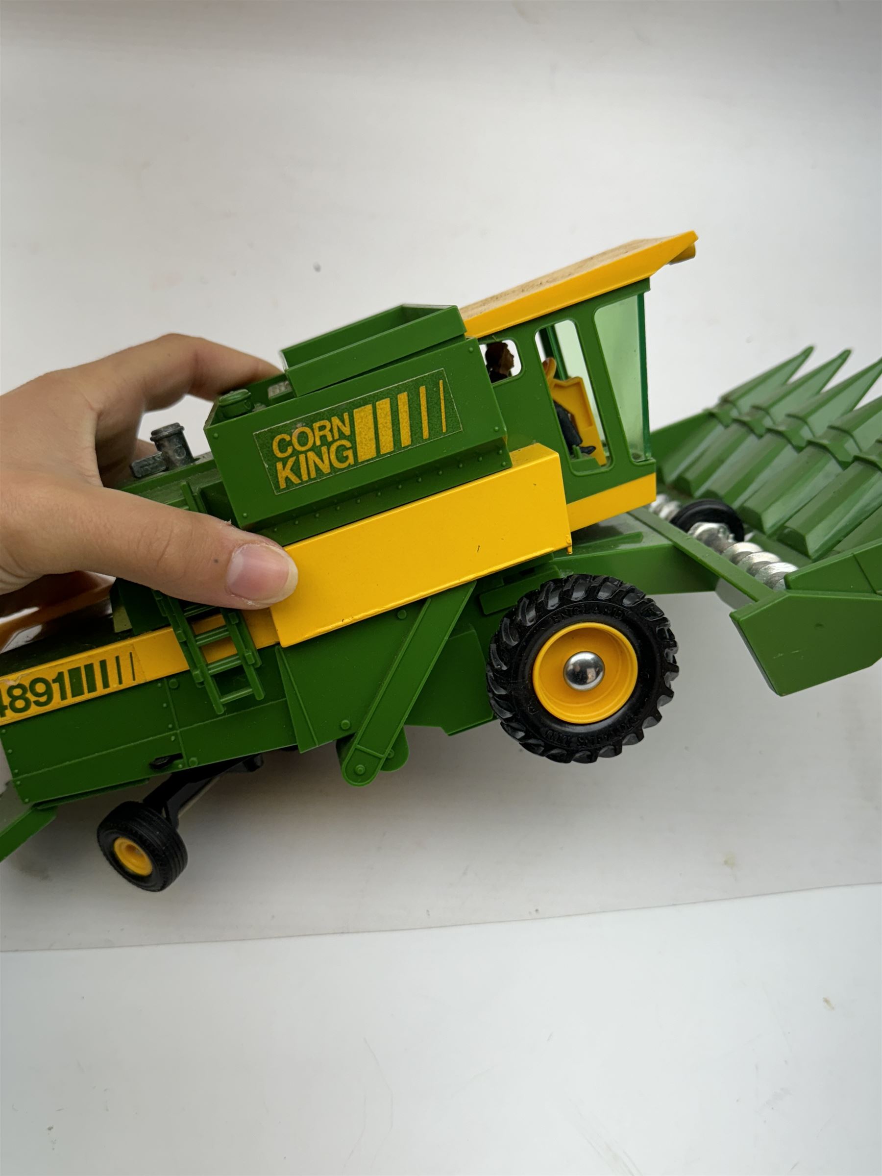 Collection of predominantly late 1970s/early 1980s Britains diecast vehicles and farming equipment, including Corn King, tractors, JCBs, horsebox, skip lorry, etc together with figures and accessories