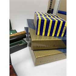 Collection of various snooker cues to include a Lewis & Wilson cue, Master Cue Makers, two other cues, three hard cases, two boxes of Snooker Balls, twelve boxes of chalk and related posters